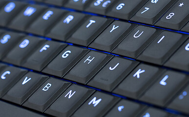 Image showing Close up led backlit computer laptop keyboard
