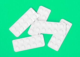 Image showing Pill strips on green background