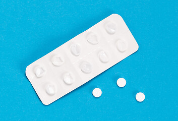 Image showing Pill strip on blue on background