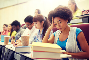 Image showing group of students with coffee writing on lecture