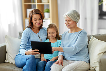 Image showing mother, daughter and grandmother with tablet pc