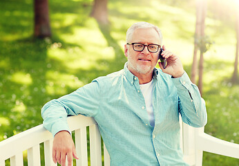 Image showing senior man calling on smartphone at summer park