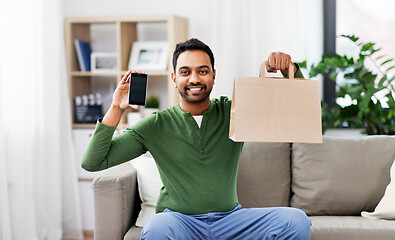 Image showing indian man using smartphone for food delivery