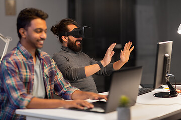 Image showing creative man in virtual reality headset at office