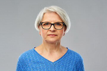 Image showing portrait of senior woman in glasses over grey