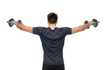 Image showing young man with dumbbells exercising