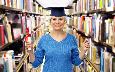 Image showing happy senior graduate student woman with diploma