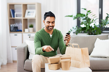 Image showing indian man using smartphone for food delivery