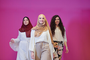 Image showing muslim women in fashionable dress isolated on pink