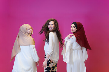 Image showing muslim women in fashionable dress isolated on pink