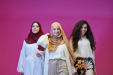 Image showing muslim women in fashionable dress isolated on pink