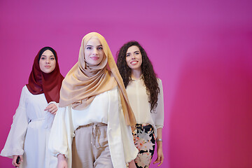 Image showing muslim women in fashionable dress isolated on pink