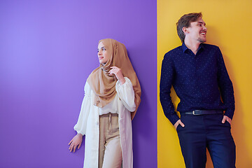 Image showing portrait of young muslim couple isolated on colorful background