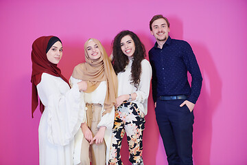 Image showing group portrait of young muslim people isolated on pink