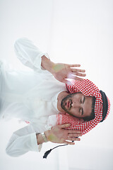 Image showing young arabian muslim man praying on the glass floor at home