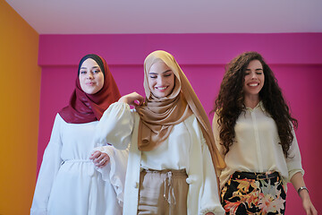 Image showing muslim women in fashionable dress isolated on pink