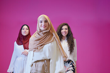 Image showing muslim women in fashionable dress isolated on pink