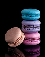 Image showing Colorful macaroon each other and one next