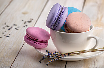 Image showing Macaroons in cup with lavender on saucer