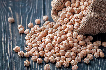 Image showing Bag with chickpeas on table closeup