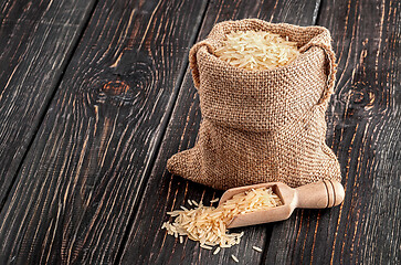 Image showing Bag with rice and spoon stands