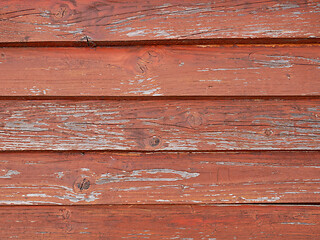 Image showing Old weathered wooden roof pained in red
