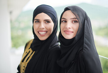 Image showing portrait of beautiful muslim women standing on balcony