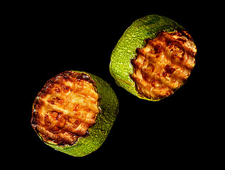 Image showing Two slices of zucchini grill rotated