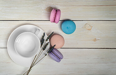 Image showing Macaroons next to coffee cup top view