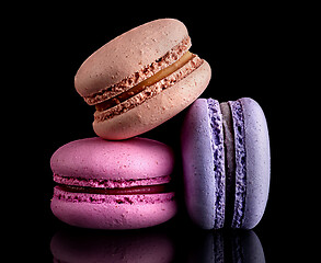 Image showing Heap of colorful macaroons on black