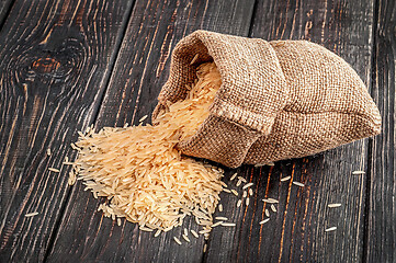 Image showing Sack of long rice lies