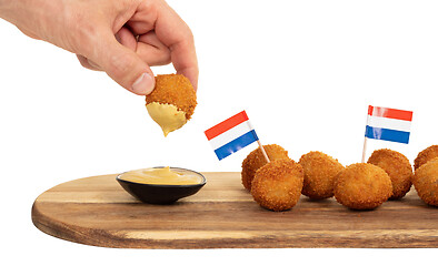 Image showing Dutch traditional snack bitterbal in a hand
