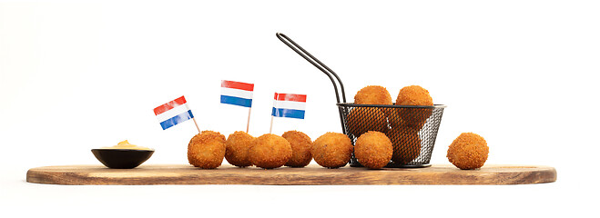 Image showing Dutch traditional snack bitterbal on a serving board