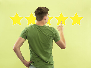 Image showing Man touching five star symbol to increase rating of company, app or service