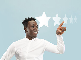 Image showing Man touching five star symbol to increase rating of company, app or service