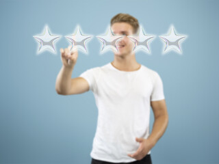 Image showing Man touching five star symbol to increase rating of company, app or service