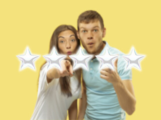 Image showing Couple touching five star symbol to increase rating of company, app or service