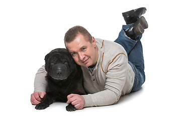 Image showing Man with shar pei dog