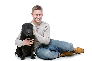 Image showing Boy with shar pei dog