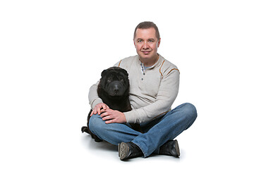 Image showing Man with shar pei dog