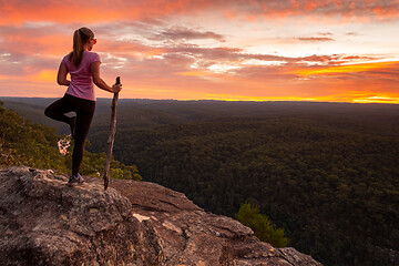 Image showing Woman serenity yoga while watching magnificent sunset