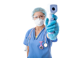 Image showing Medical nurse taking a temperature check for fever with infrared