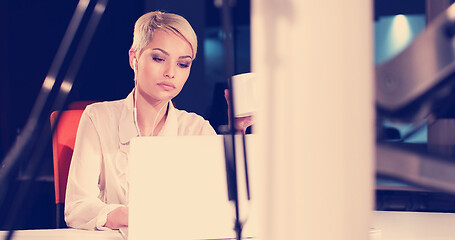 Image showing woman working on laptop in night office