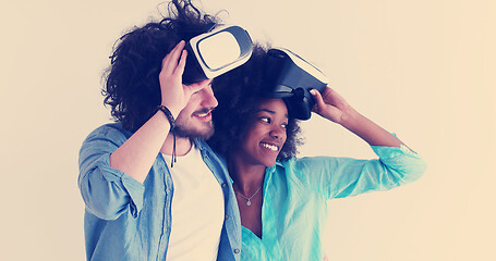 Image showing multiethnic couple getting experience using VR headset glasses