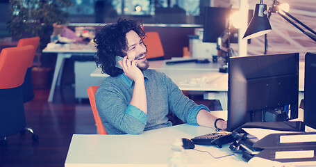 Image showing businessman working using a computer in startup office