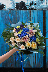 Image showing Female hands holding beauty bouquet