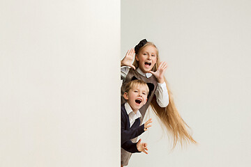 Image showing Banner with a surprised children peeking at the edge