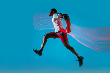 Image showing Full length portrait of active young muscular running man,