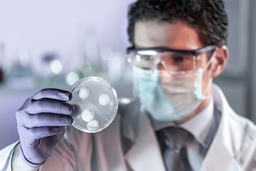 Image showing Scientist working in corona virus vaccine development laboratory research facility.