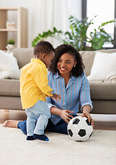 Image showing mother and baby playing with soccer ball at home